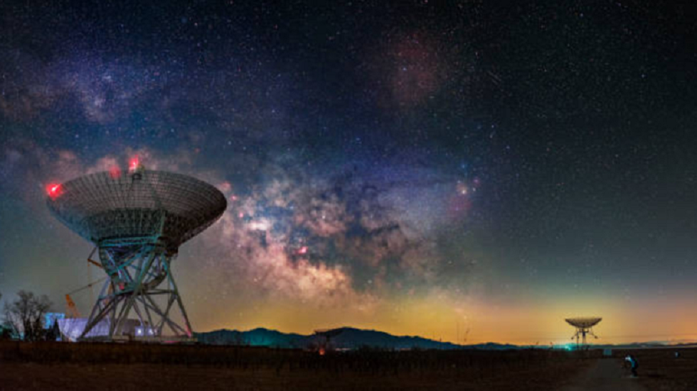 Earth receives a radio signal from a galaxy 9 billion light-years away